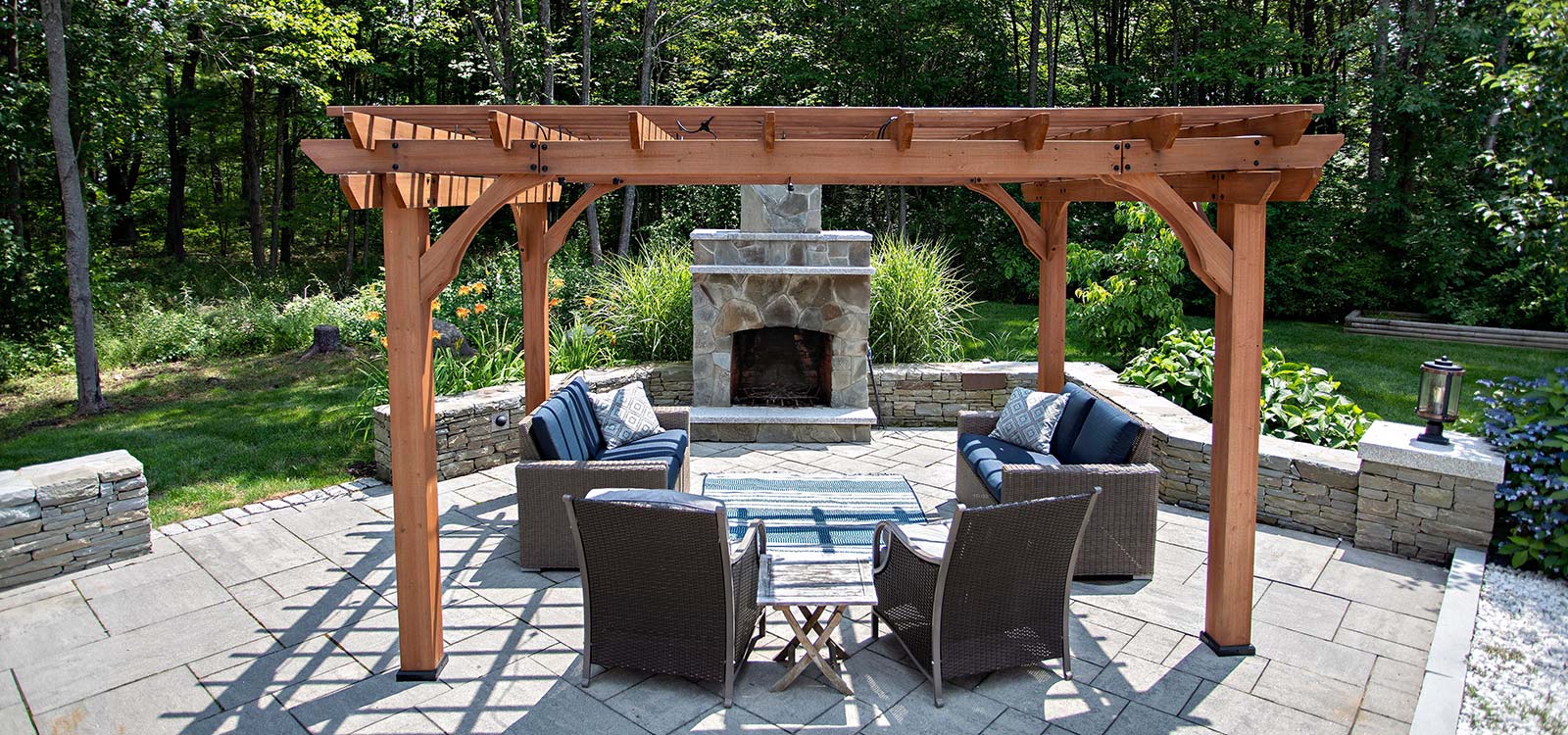 outdoor couch with a fireplace
